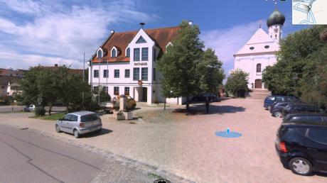 Dreidimensionale Ansicht von Rehlings Rathaus und Kirche. Die Kennzeichen der Autos sind unkenntlich gemacht.