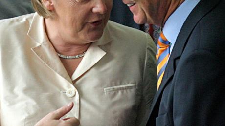 Angela Merkel und Franz Beckenbauer.