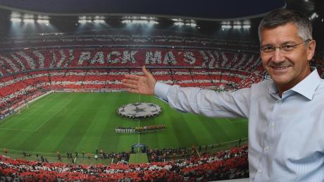 Präsident Herbert Hainer zeigt auf die Heimstätte seines FC Bayern, die Allianz Arena. Dort hat er meist mehr zu lachen als bei der jüngsten Jahreshauptversammlung.