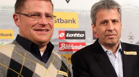 Sportdirektor Max Eberl (l) will Trainer Lucien Favre für die Reus-Millionen neue Spieler holen. Foto: Roland Weihrauch dpa