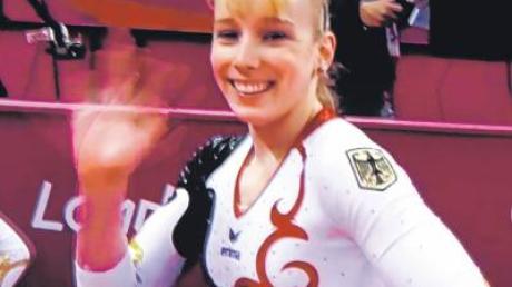 Ein Strahlen für die Kameras: Janine Berger bei ihrem gestrigen Auftritt bei den Olympischen Sommerspielen in London. 