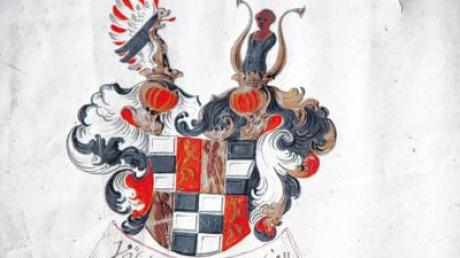 Das farbenprächtige Wappen der Freiherren von Vöhlin, links ein goldener Löwe mit aufgeworfenem Schwanz, rechts ein Mohr zwischen zwei Büffelhörnern. 