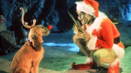 Jim Carrey als Grinch und wiederrum verkleidet als Weihnachtsmann, der einen fiesen Plan hat.
