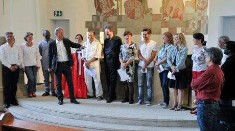 Der evangelische Pfarrer Detlev Möller stellte die internationalen Teilnehmer am Friedensgebet in der Christuskirche vor.  
