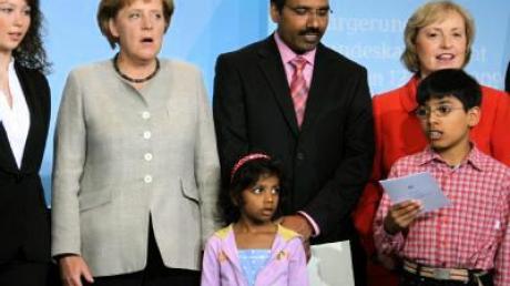 Merkel ruft Ausländer zur Einbürgerung auf