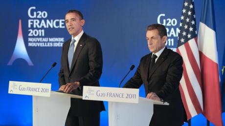 US-Präsident Obama und Gipfel-Gastgeben Sarkozy geben vor Beginn des G20-Gipfels eine Pressekonferenz. Foto: Lionel Bonaventure dpa
