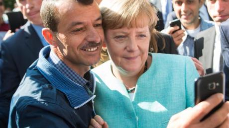 Das Selfie mit einem Flüchtling ging um die Welt und wurde zum Symbol für Merkels Flüchtlingspolitik.