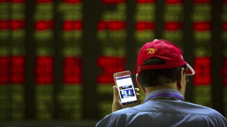 Chinesischer Investor an der Börse in Peking. Die USA und China bleiben im Handelsstreit auf Konfrontationskurs.