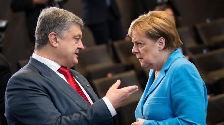 Der ukrainische Präsident Petro Poroschenko, Angela Merkel: „Das kann nur die Kanzlerin!“ 