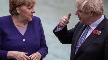 Boris Johnson (r) hat Angela Merkel in einem Gastbeitrag für «Bild» gewürdigt.