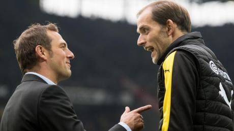 Heute Abend treffen sie im Pokal wieder aufeinander: Markus Weinzierl (links) mit dem FC Augsburg und Thomas Tuchel mit Borussia Dortmund.