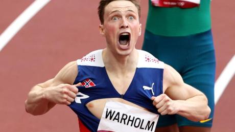 Norwegens Leichtathletik-Star Karsten Warholm rennt Weltrekord über die 400 Meter Hürden.